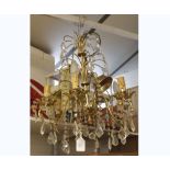A MODERN SIX LIGHT CHANDELIER, WITH GLASS PRISMATIC DROPS, APPROX 17" WIDE