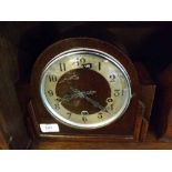 EARLY 20TH CENTURY ENFIELD OAK CASED MANTEL CLOCK OF ARCHED FORM, THE DIAL WITH ARABIC NUMERALS