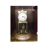 20th century brass 400-day torsion mantel clock under glass dome, approx 11 1/2" high in total,