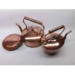 Mixed lot: two vintage copper kettles and a copper hot water bottle