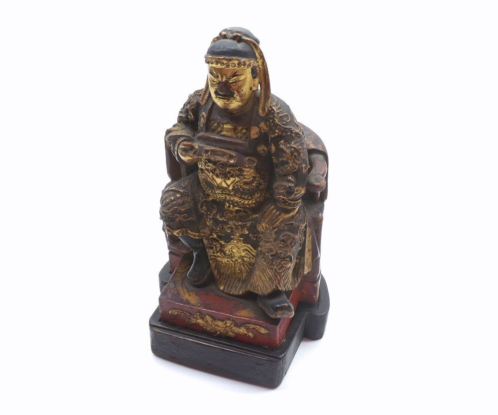 Chinese carved hardwood figure of a seated warlord on his throne, decorated throughout with gilded