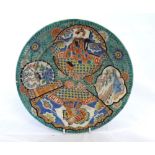 Chinese circular plate, painted with panels of interior and landscape scenes on a predominantly