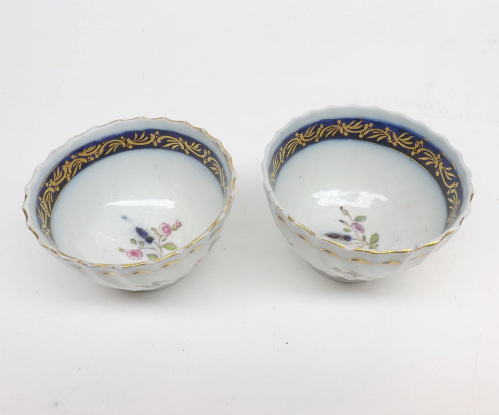 Pair Late 18th century English teabowls with gilt and floral decoration.