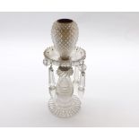 A small 19th century cut clear glass candle holder, with glass prismatic drops, 7 1/2" high