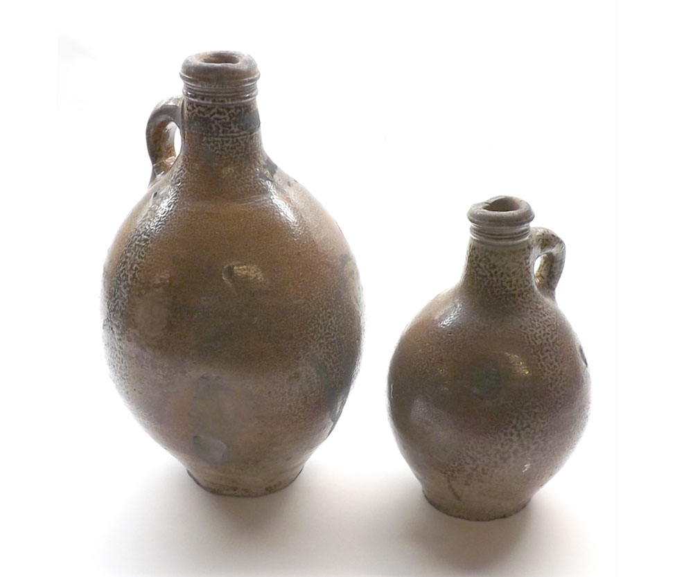 Two 18th century salt glazed bottles, largest 12" high (2)