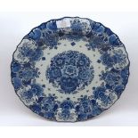 20th century Delft plate decorated in blue and white with floral sprays marked "ram, made in