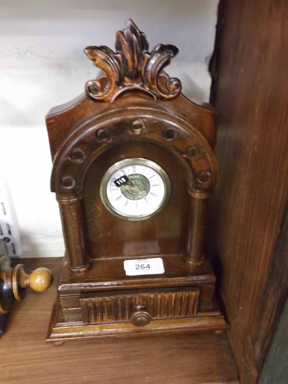 20th century mantel clock, the stained wooden architectural case with small drawer to base, 10 1/