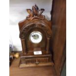 20th century mantel clock, the stained wooden architectural case with small drawer to base, 10 1/