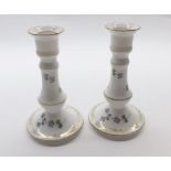 Pair of early 20th century Limoges candlesticks, decorated with floral sprays and gilt highlights, 6