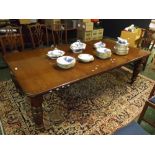 Victorian oak extending dining table with two additional leaves, raised on fluted legs