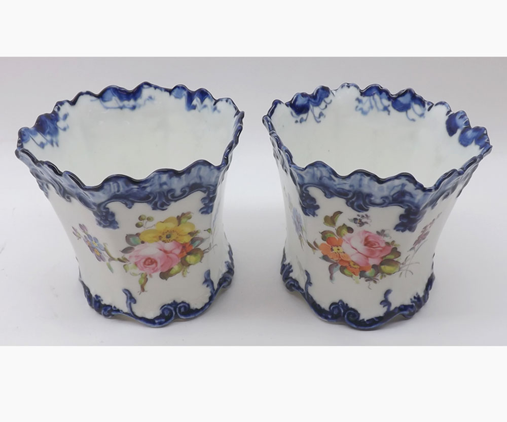 Pair of Royal Crown Derby small jardini¦res, of tapering hexagonal form, with blue rims and