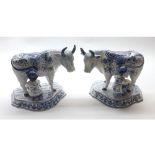 Pair of 19th or early 20th century Delft blue and white milkmaid figures, 7" high, stylised marks to