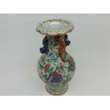 Famille rose baluster vase, the neck applied with kaolin and lizards and the body well-painted in