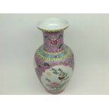Chinese baluster vase, of tapering form, painted predominantly in famille rose and verte with panels