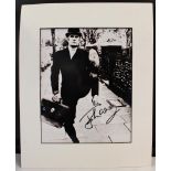 JOHN CLEESE, signed monochrome photograph of "Silly Walks" from Monty Python, housed in cardboard