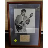 CHUCK BERRY, autograph on paper, inset into glazed display with monochrome photograph, the whole