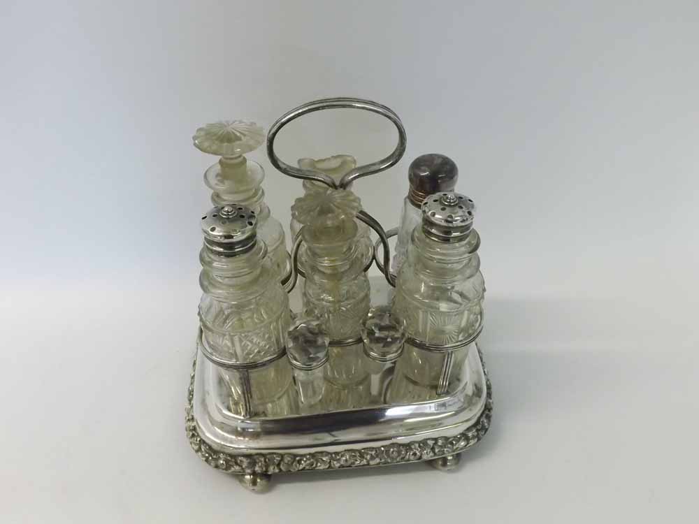 Victorian electroplated cruet stand of shaped rectangular form, with applied thistle and leaf