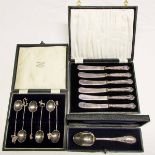 Mixed Lot Silver Wares: a cased decorated dessert spoon, case of six novelty continental coffee