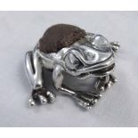 Modern continental white metal novelty pin cushion, modelled in the form of a crouching frog with