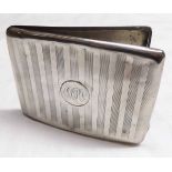 George V cigarette case of shaped and hinged rectangular form with engine turned decoration,