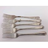 Set of five George III silver Hanoverian feathered edged table forks, hallmarked London 1799, makers