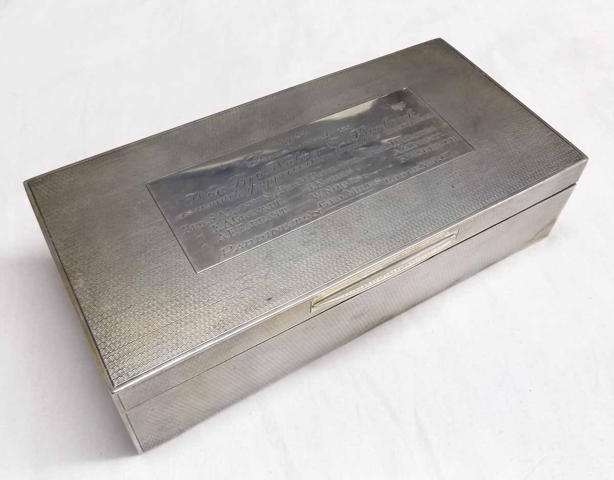 George V presentation engraved table cigarette box of hinged rectangular form with all over engine