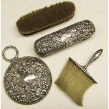 Mixed Lot: dressing table hand mirror with bevelled circular glass and ring handle, heavily embossed