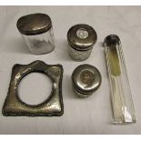 Mixed Lot: three various silver lidded and clear cut glass toiletry bottles; together with a