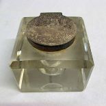 A late Victorian silver mounted and clear cut glass inkwell, the square body with bevelled edges