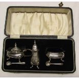 George V cased three-piece cruet set comprising pepper caster, mustard and open salt, the latter