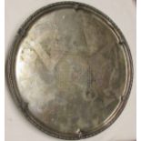 George V presentation salver of circular form with cast and applied floral rim, and centred with