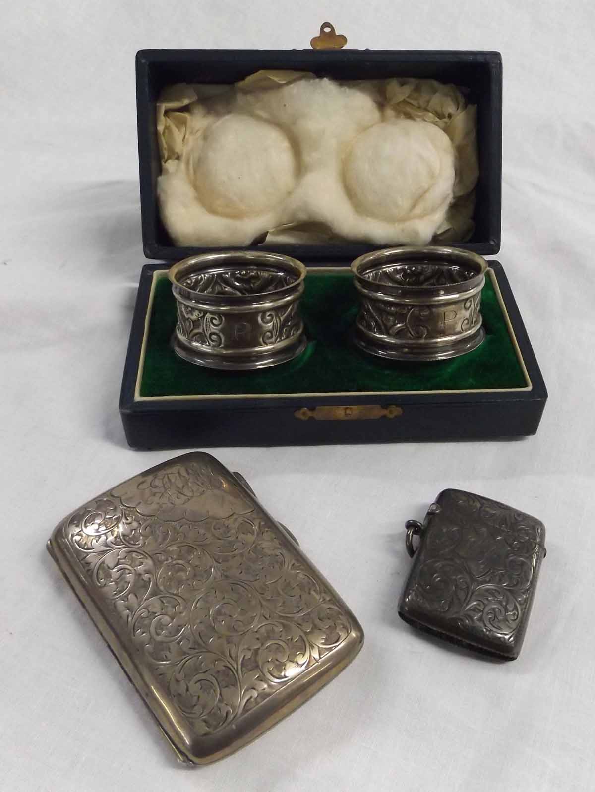 Mixed Lot: cased pair of cylindrical napkin rings, Birmingham 1905, together with a shaped hinged