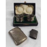 Mixed Lot: cased pair of cylindrical napkin rings, Birmingham 1905, together with a shaped hinged