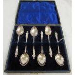 Cased set of six George V teaspoons, each with figural finials in a fitted case, Birmingham 1919,