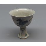 Small 19th century Chinese pedestal cup, decorated with continuous scene of running horses on a pale