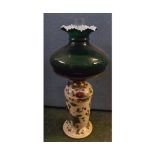 Victorian oil lamp, clear glass font, dark green tinted vesta shade and floral decorated ceramic