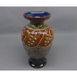 Large Royal Doulton stoneware baluster vase decorated with floral swags, marked to base "3307",