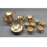 Japanese gilt decorated three-piece coffee service and accompanying cups and saucers