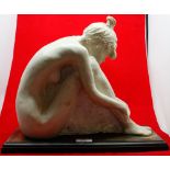 Composition figure of a seated nude, raised on wooden plinth base, base approx 15 1/2" wide