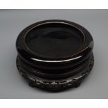 Chinese circular black glazed bowl, with blue 6 character mark to base, raised on a turned
