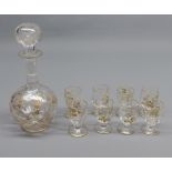 Small 19th century clear glass and gilt decorated spirit decanter, and eight matching glasses