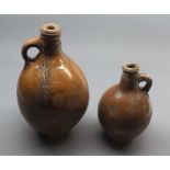 Two 18th century salt glazed bottles, largest 12" high (2)