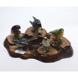 Collection of five Beswick birds, and accompanying tree trunk stand (6)