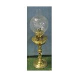 Late 19th or early 20th century oil lamp, with clear glass chimney and shade, the brass body with