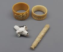 Mixed Lot: small ivory needle case, dog's head whistle and two napkin rings (4)