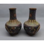 Pair of 20th century cloisonn baluster vases, decorated with dragons etc, approx 8" high