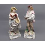 Pair of late 19th or early 20th century continental figures of a young lady and gent, raised on