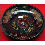 20th century studio pottery fruit bowl decorated with stylised flowers, unsigned, 12" diameter