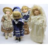 Group of four modern porcelain headed dolls, in various costumes plus a dolls' chair