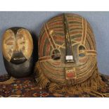 20th century Congolese Kywebe mask and one other, largest piece 19" high (2)